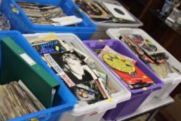 A LARGE QUANTITY OF SEVEN INCH SINGLE RECORDS CONTAINED IN SEVEN PLASTIC TRAYS TO INCLUDE MANY
