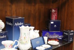 A SHELF CONTAINING BOXED AYNSLEY, WORCESTER ETC