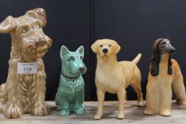 FOUR DOG FIGURES TO INCLUDE A BESWICK AFGHAN HOUND, BESWICK GOLDEN LABRADOR AND TWO SYLVAC DOGS