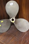 A SMALL BRASS SHIPS PROPELLER