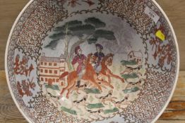 A LARGE ORIENTAL BOWL DECORATED WITH HUNTING SCENES AND SIX FIGURE CHARACTER MARK TO BASE - BADLY