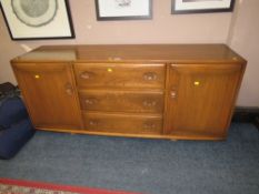 AN ERCOL SIDEBOARD - W 155 CM