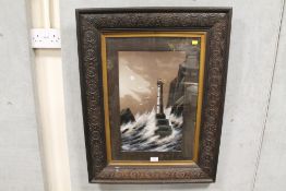 A CARVED WOODEN FRAMED OIL ON CANVAS OF A COASTAL LIGHTHOUSE ON A MOONLIT STORMY NIGHT