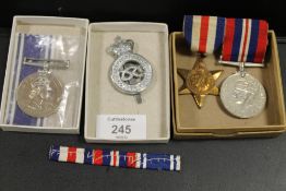 A SMALL SELECTION OF MEDALS, RIBBONS, BADGES ETC