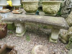 A LARGE CURVED STONE GARDEN BENCH, W 122 cm