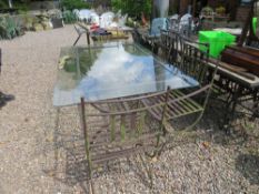 A VINTAGE GLASS TOPPED GARDEN TABLE AND FOUR CHAIRS
