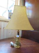 A TRADITIONAL BRASS TABLE LAMP WITH SHADE