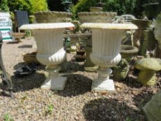 A PAIR OF WHITE PAINTED CAST IRON URNS, H 70 cm (2)