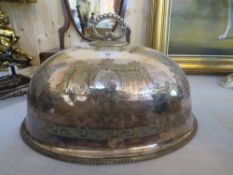 AN ANTIQUE LARGE SILVER PLATED SERVING DOME WITH ENGRAVED ARMORIAL DETAIL, W 41 cm
