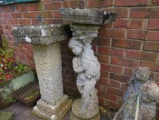 A FIGURATIVE GARDEN BIRD BATH