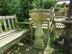 A STONE PLANTER ON RIBBED PLINTH, H 89 cm