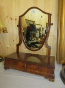 A 19TH CENTURY MAHOGANY SHIELD SHAPED DRESSING MIRROR, WITH TWO SMALL FREE DRAWERS, H 56 cm, W 45.