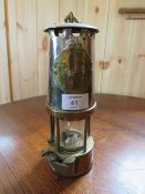 A VINTAGE BRASS MINERS LAMP