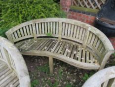 A CURVED HARDWOOD GARDEN BENCH, L 158 cm