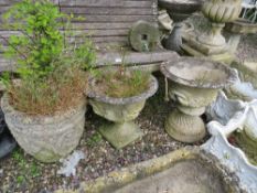 A STONE CIRCULAR URN WITH CONTENTS AND ANOTHER CIRCULAR URN (2)