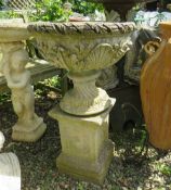 A STONE GARDEN FLORAL URN ON SQUARED PLINTH, H 92 cm