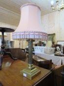 A LARGE AND HEAVY BRASS CORINTHIAN COLUMN TABLE LAMP AND SHADE
