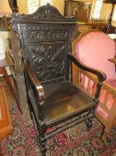 A 19TH CENTURY OAK CARVED WAINSCOTT STYLE ARMCHAIR