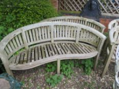 A CURVED HARDWOOD GARDEN BENCH, L 158 cm