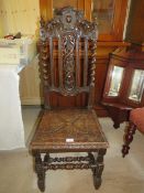 A CARVED OAK JACOBEAN STYLE CHAIR