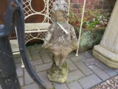 A SMALL STONE GARDEN STATUE OF A GIRL
