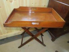 A 19TH CENTURY MAHOGANY BUTLERS TRAY, THE TRAY WITH TWIN HANDLES RAISED ON AN 'X' FRAME STAND
