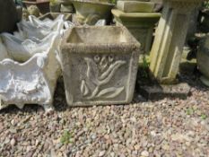 A MODERN SQUARE GARDEN PLANTER WITH FLORAL DETAIL