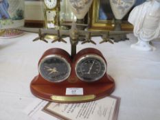 A BRADFORD EXCHANGE 70th ANNIVERSARY DESK CLOCK WITH C.O.A.