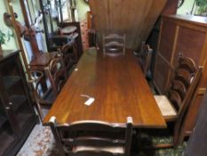 AN OAK REFECTORY STYLE DINING TABLE WITH SIX WICKER SEAT CHAIRS