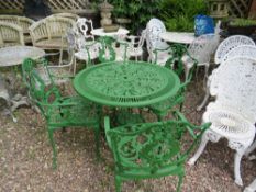 A CAST GREEN PAINTED GARDEN TABLE WITH FOUR CHAIRS