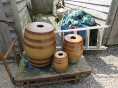 THREE GRADUATED STONEWARE BANDED BARRELS, LARGEST H 59 cm (3)
