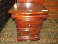 A REPRODUCTION TWO DRAWER BEDSIDE CHEST