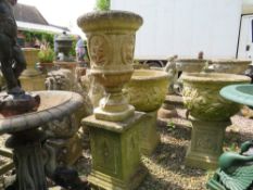 A STONE GARDEN URN WITH FIGURATIVE DETAIL, H 117 cm