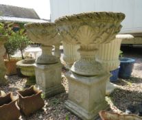 A PAIR OF GARDEN STONE URNS ON SQUARED PLINTHS, Overall H 82 cm (2)