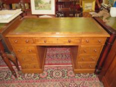 A 19TH CENTURY MAHOGANY TWIN PEDESTAL DESK WITH GREEN LEATHER WRITING SURFACE, WITH AN OF NINE