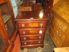 A REPRODUCTION MAHOGANY SMALL FOUR DRAWER CHEST