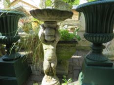 A FIGURATIVE GARDEN BIRDBATH