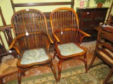 A PAIR OF REPRODUCTION WINDSOR STYLE ARMCHAIRS, each with upholstered seats (2)