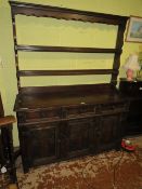 A VINTAGE CARVED OAK DRESSER WITH PLATE RACK, W 138 cm