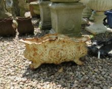 A VINTAGE CAST IRON OVAL LOW PLANTER