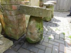 AN ANTIQUE SANDSTONE STADDLESTONE STEM WITH A WHEEL TOP, H 67 cm