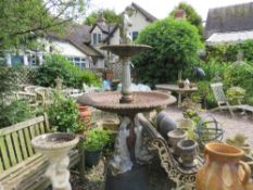 A LARGE AND IMPRESSIVE CAST IRON TWO TIER WATER FOUNTAIN WITH CHERUBIC FISH CAST DETAIL - POSSIBLY