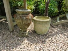 AN OLD STONE GARDEN URN TOGETHER WITH A MODERN URN (2)