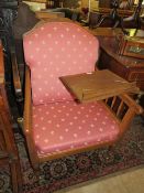 AN UNUSUAL OAK FRAMED UPHOLSTERED 'READING CHAIR'