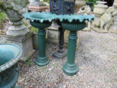 A PAIR OF CAST GREEN PAINTED URNS ON PLINTHS, H 74 cm (2)