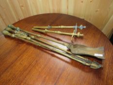 A SET OF 19TH CENTURY BRASS FIRE IRONS AND DOGS