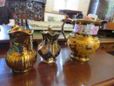 A LARGE VICTORIAN COPPER LUSTRE JUG, H 23 cm, WITH TWO SMALLER JUGS (3) A/F