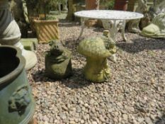 A SMALL GARDEN PIG ORNAMENT AND A GNOME HOUSE (2)
