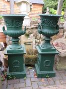A PAIR OF GREEN PAINTED CAST CAMPANA URNS ON STANDS, H 110 cm (2)