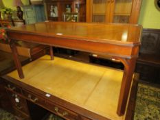 A REPRODUCTION MAHOGANY COFFEE TABLE